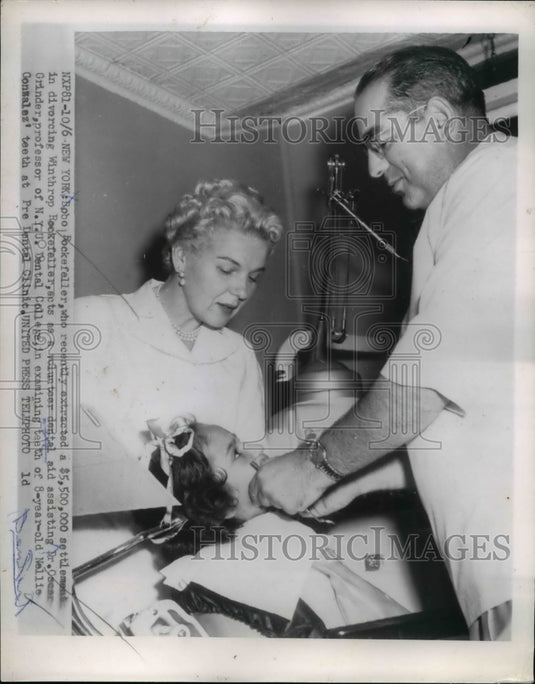 1954 Bobo Rockefeller acts as volunteer dental aid and Dr. Grinder - Historic Images