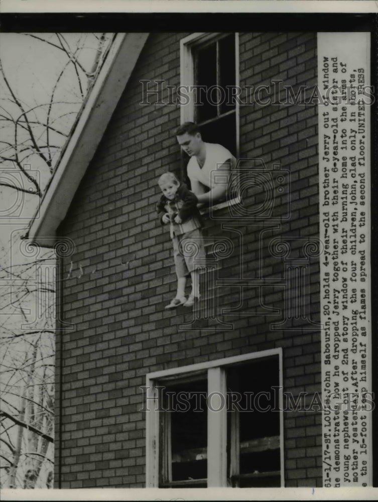 1953 John Sabourin Demonstrating How He Dropped Brother During Fire - Historic Images