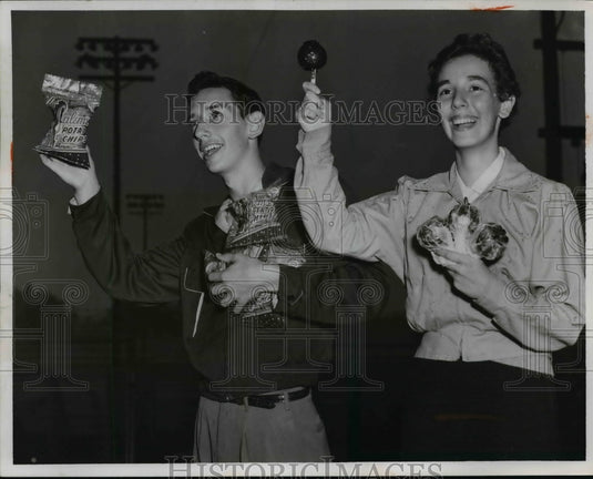 1955 Phil Resnicks and Charlote Rosentha with Chips and Lollipops. - Historic Images