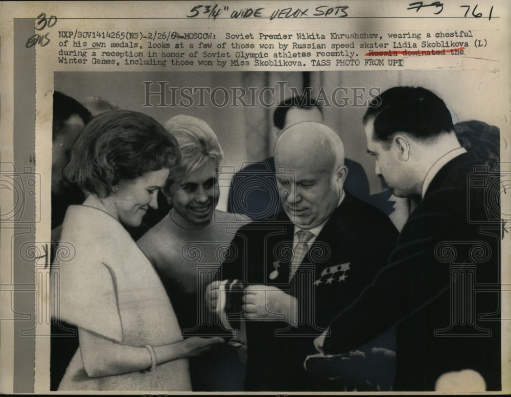 1964 Soviet Premier Nikita Khrushchev looks at Olympic medal-Historic Images