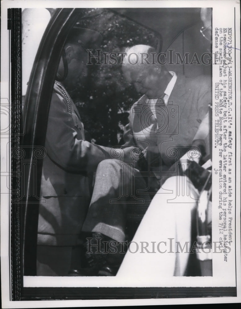 1957 Aide helps President Eisenhower strap into helicopter-Historic Images