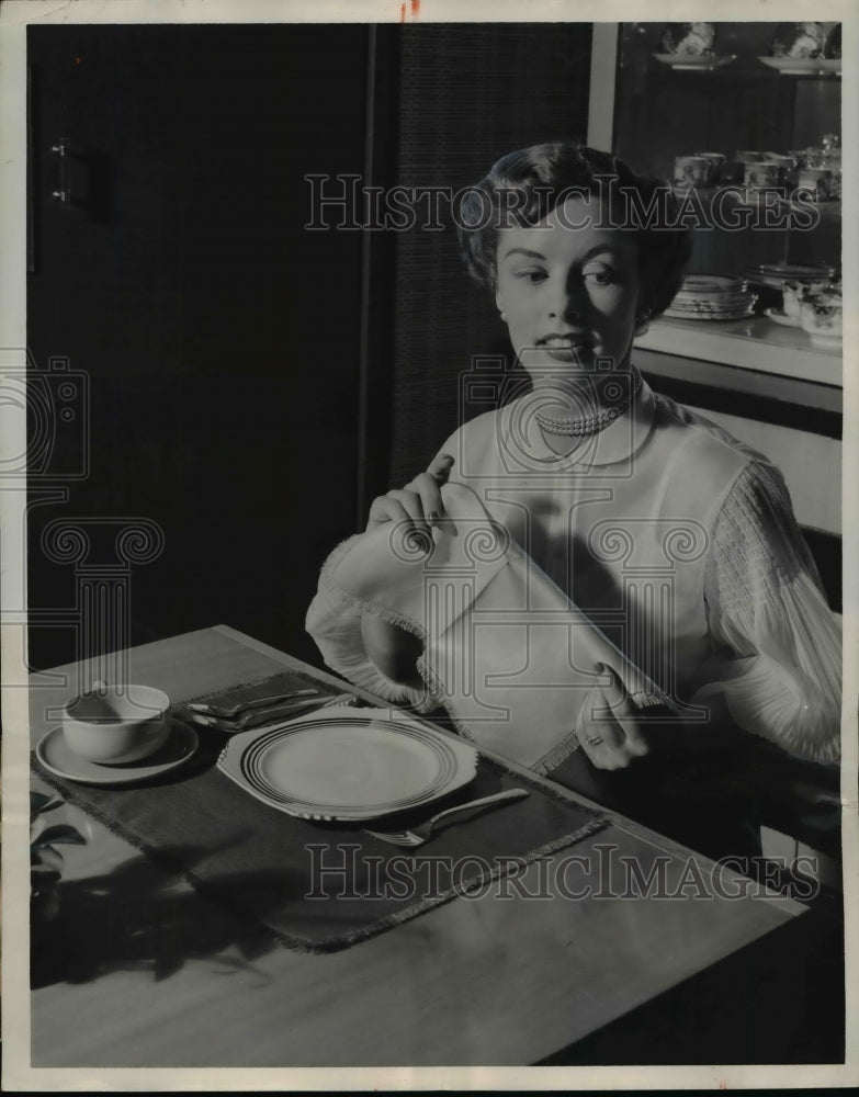 1952 Linen place mats cut down on laundry and ironing  - Historic Images