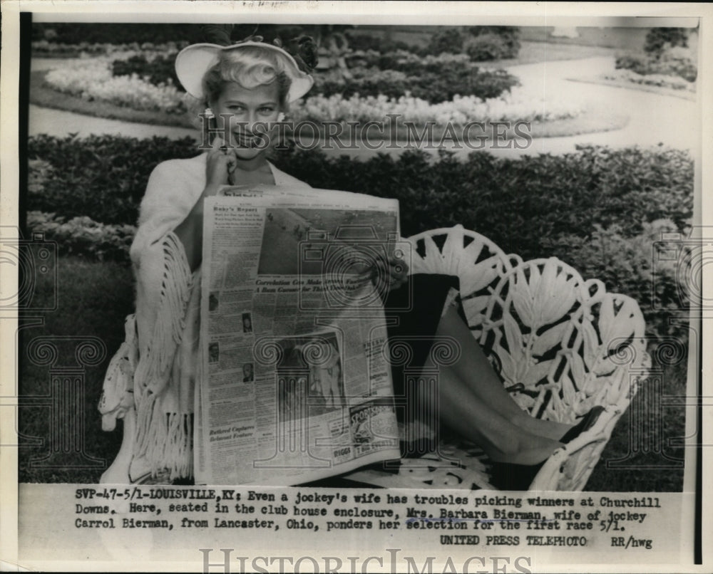 1954 Press Photo Jockey's Wife Ponders Selection for the First Race on May 1 - Historic Images