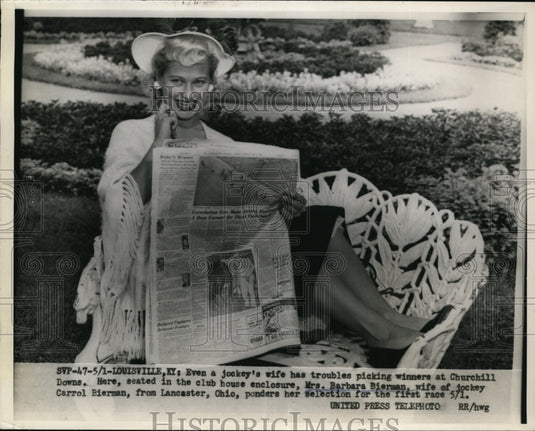 1954 Press Photo Jockey's Wife Ponders Selection for the First Race on May 1 - Historic Images
