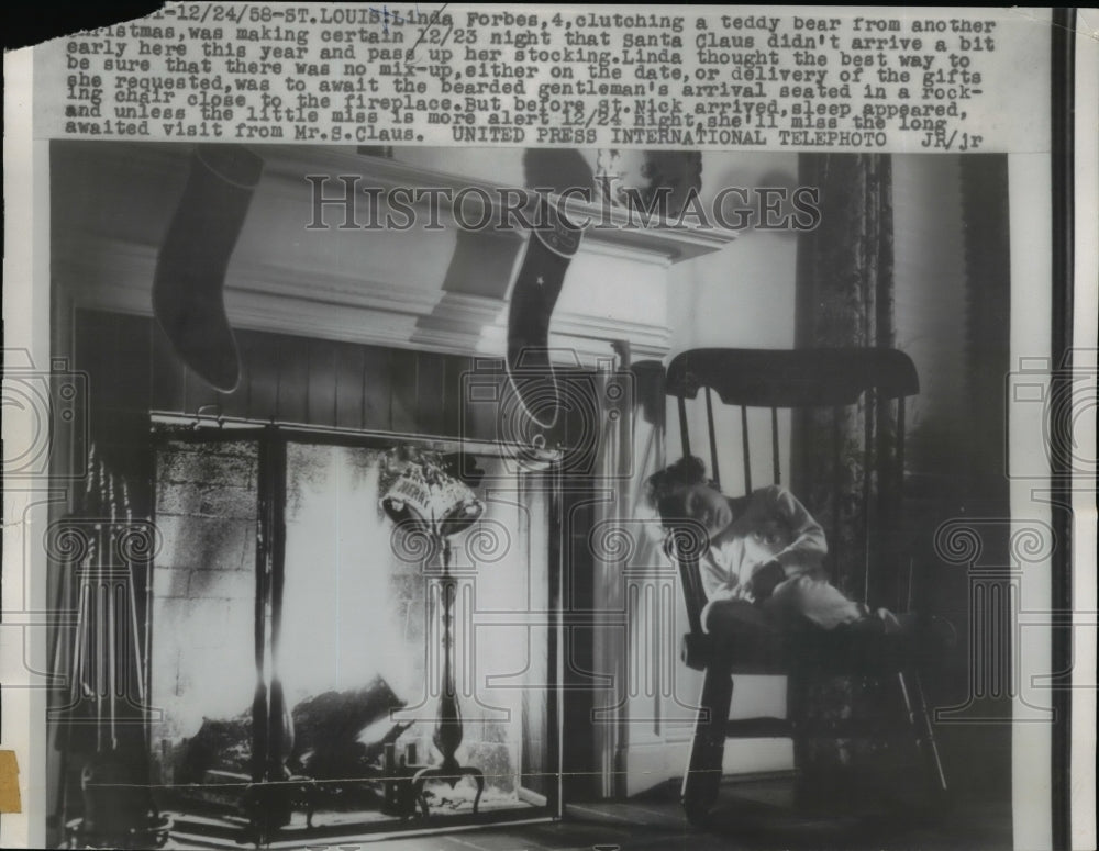 1958 Press Photo L. Forbes Clutch Teddy Bear While Making Sure Santa Isn't Early-Historic Images