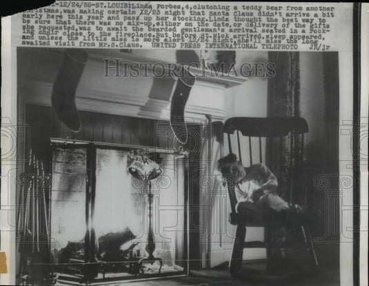 1958 Press Photo L. Forbes Clutch Teddy Bear While Making Sure Santa Isn't Early-Historic Images