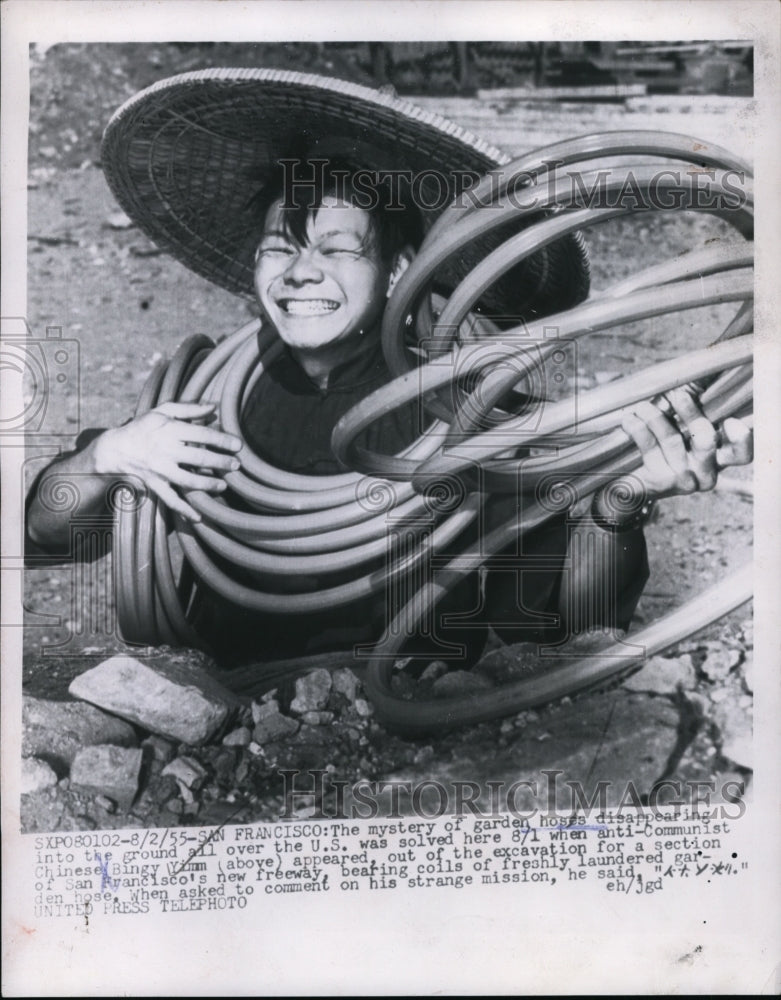 1955 Man Holding Garden Hoses at San Francisco Freeway Construction - Historic Images