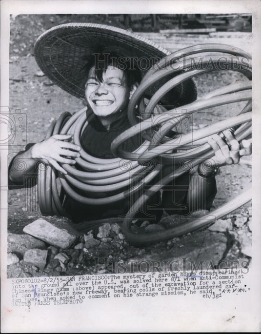 1955 Man Holding Garden Hoses at San Francisco Freeway Construction - Historic Images