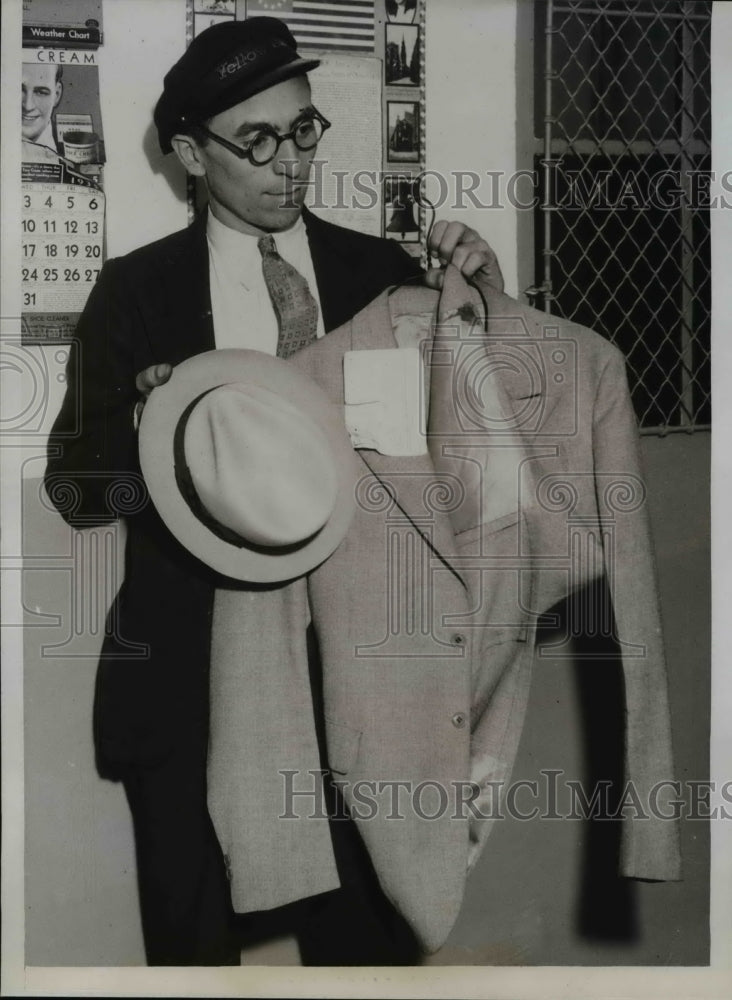 1935 Press Photo John Giannini Holding Coat & Hat of Chicago Suicide - nef20240-Historic Images