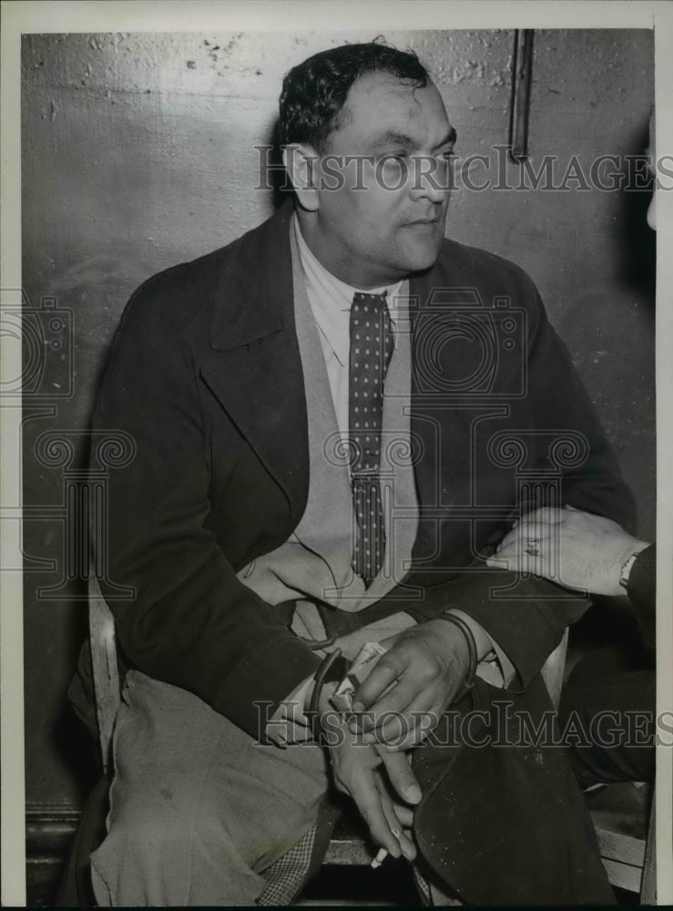 1938 Press Photo Louis Serraille Being Held By Police - nef20364 - Historic Images