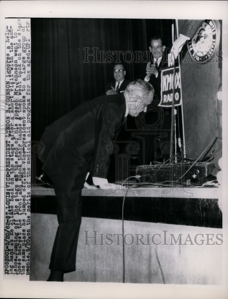 1962 Press Vice-President Johnson Climbs Back On Stage After visiting Audience-Historic Images