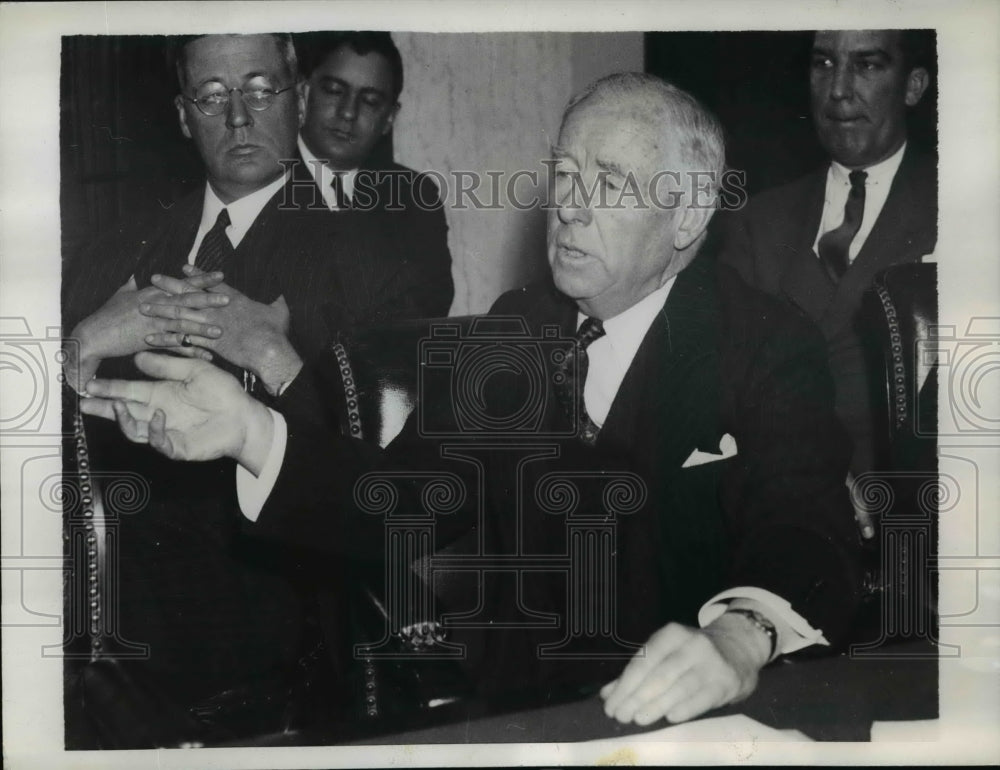 1937 A partner in the firm Morgan and Co. Thomas W Lamont testifying - Historic Images