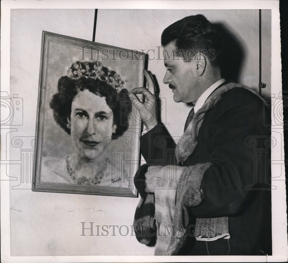 1952 Press Photo Joseph Christophe displays portrait of Queen Elizabeth II-Historic Images