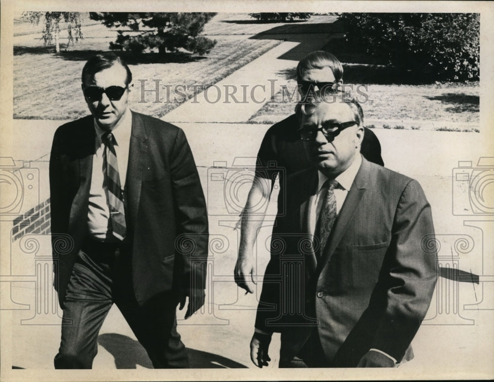 Press Photo Businessmen walking towards steps - nef36040-Historic Images