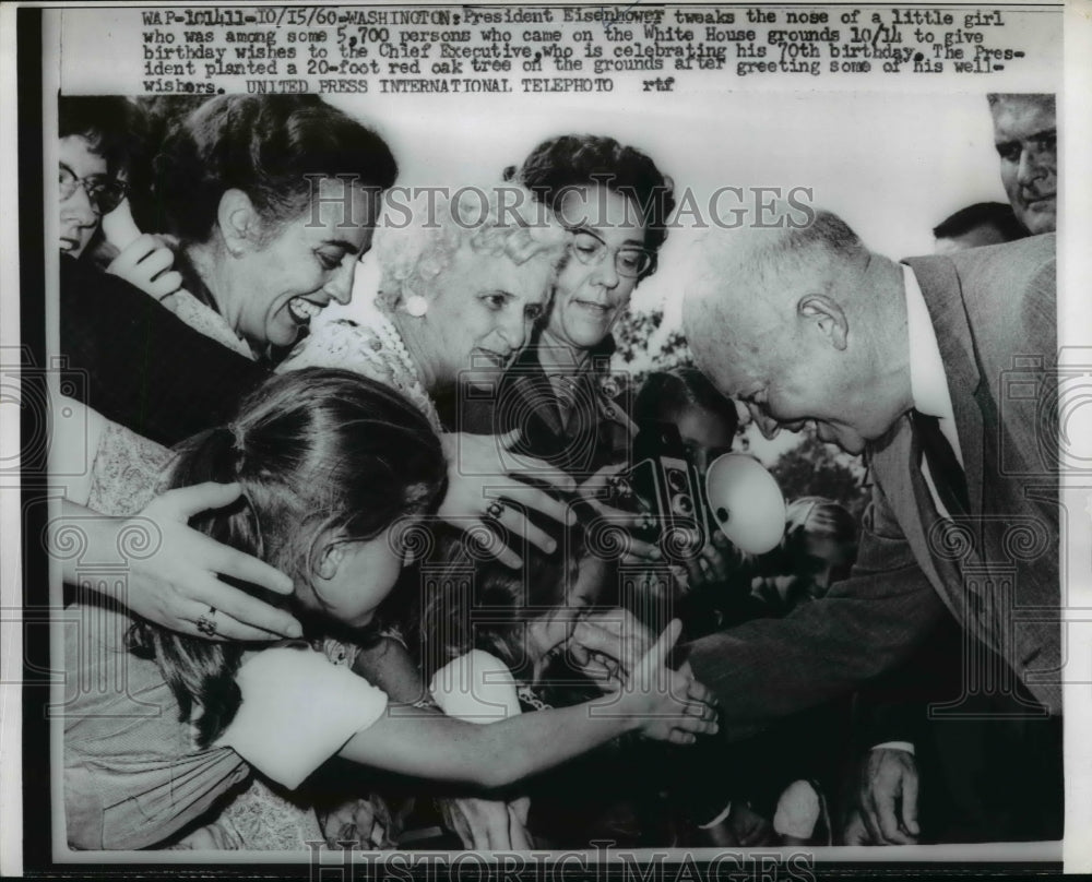 1960 Press Photo President Eisenhower tweaks nose of a little girl - Historic Images