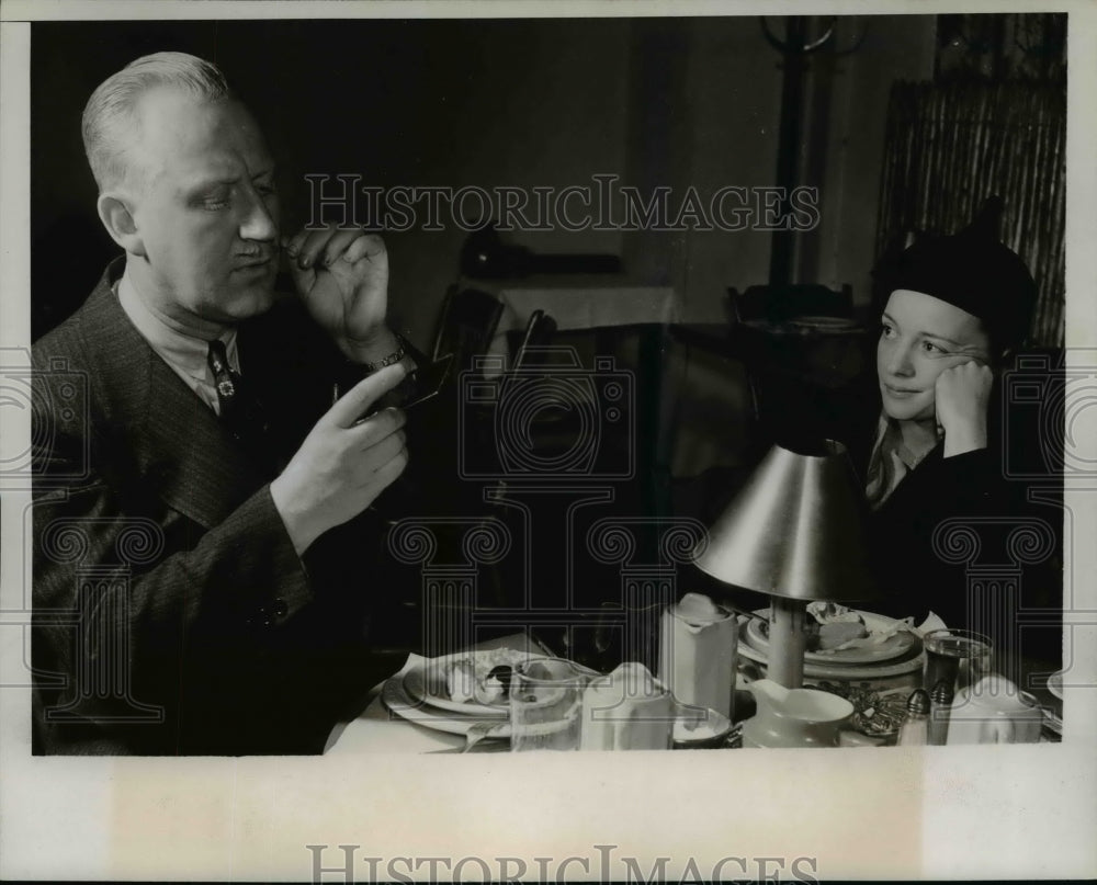 Press Photo Man Changing Mustache Wax, Woman Watching - nef41381 - Historic Images