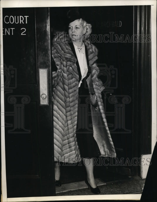 1937 Lucille McBride Leaves Courtroom After Testifying About Husband - Historic Images