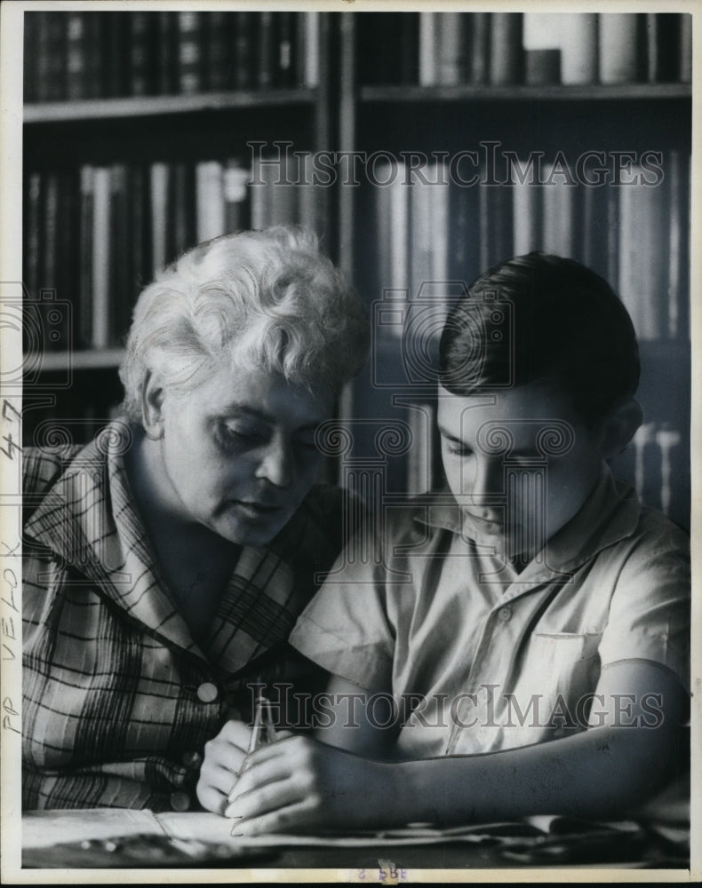 1964 President of Hungarian Parliament Mrs. Vass helping her son - Historic Images