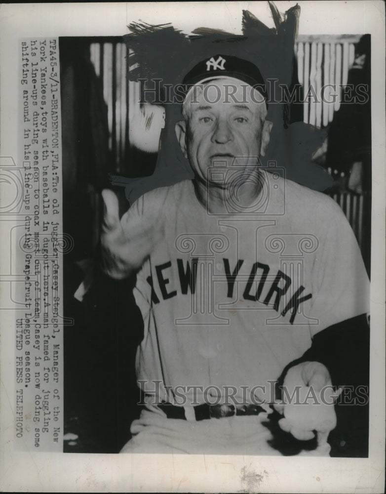 1954 Press Photo Casey Stengel Manager of New York Yankees Toys with Baseballs-Historic Images