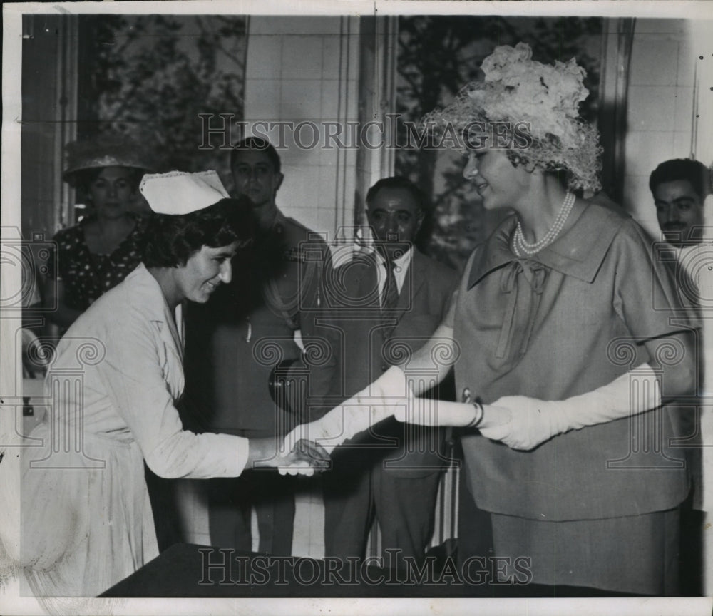 1960 Queen Farah of Iran presents diploma to nurse in Tehrans Hosp. - Historic Images