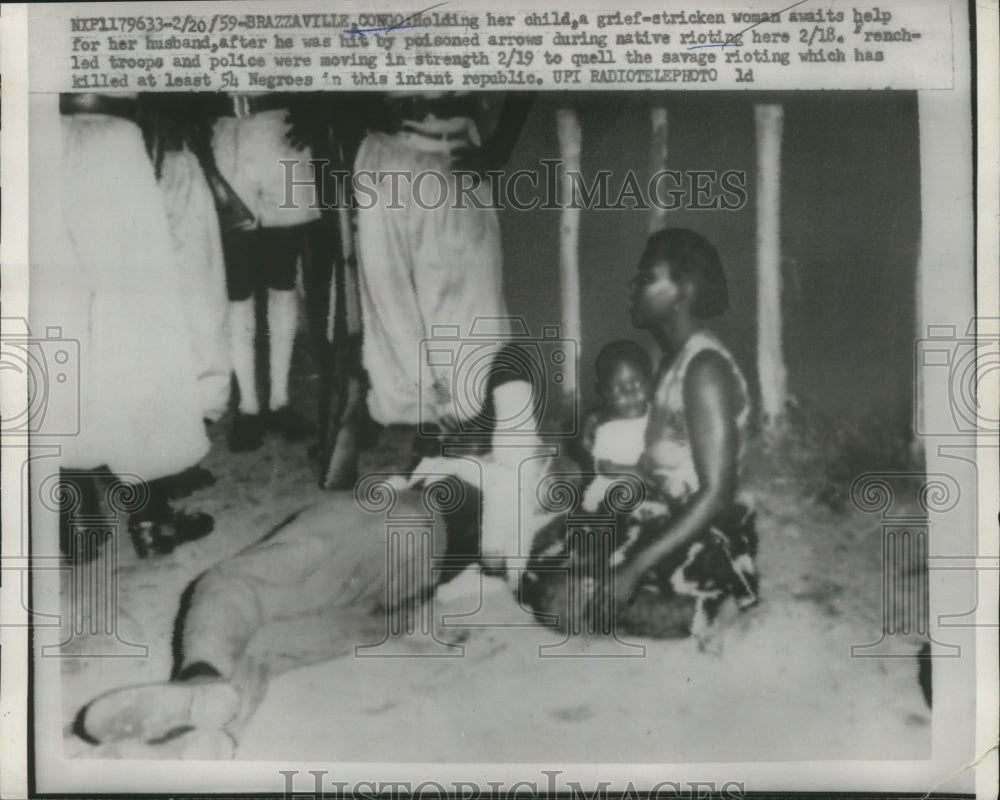 1959 Woman w Husband hit by Poison Arrows During Rioting, Congo - Historic Images