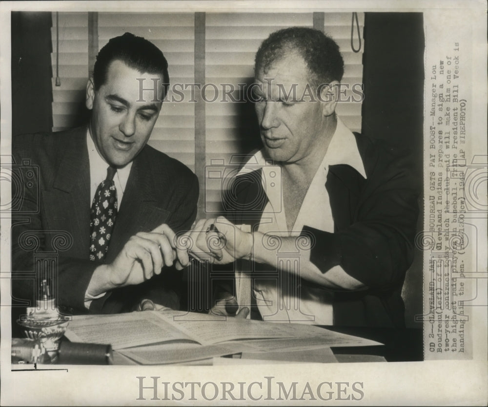 1949 Manager Lou Bourdreau of Cleveland Indians signs contract - Historic Images