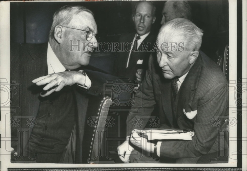 1957 John Foster Dulles confers with John B. Hollister  - Historic Images