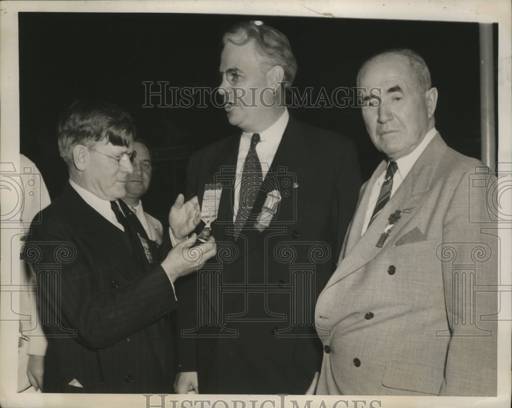 1940 Arthur H. James pins a booster badge on John W. Bricker - Historic Images