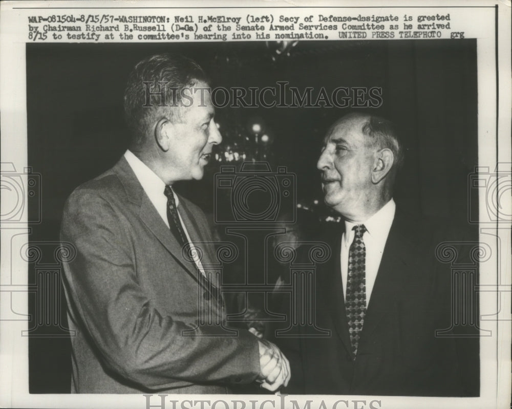 1957 Neil H. McElroy greeted by Richard B. Russell  - Historic Images