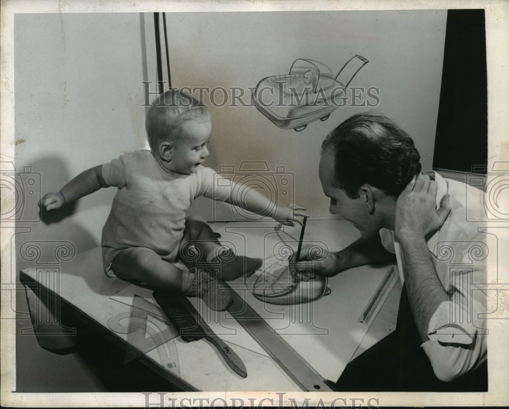 1944 Press Photo Charles Deaton B &amp; R Designer draws a Baby Carriage - Historic Images