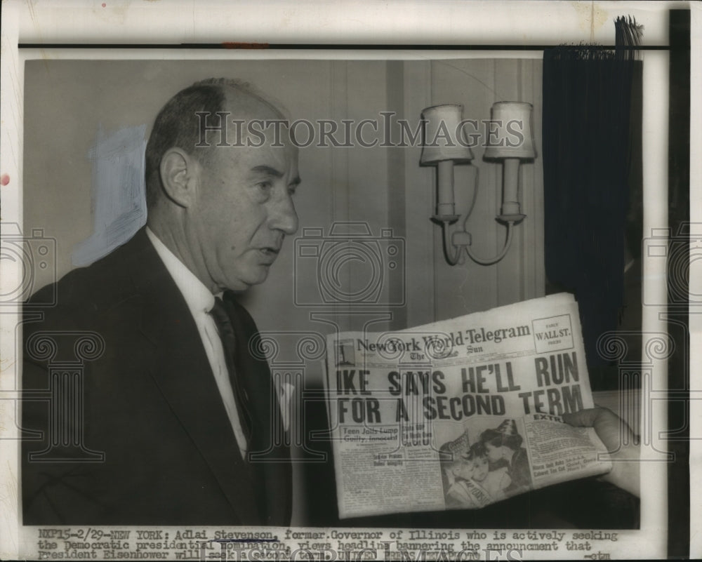 1956 Press Photo Adlai Stevenson views headline with Eisenhower announcement-Historic Images