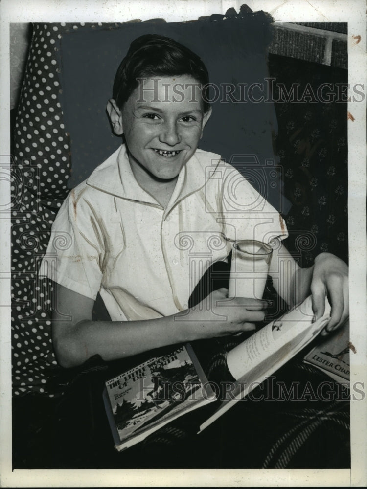 1941 Mark Gillette in Bed With Cold While His Father Delivers Papers - Historic Images