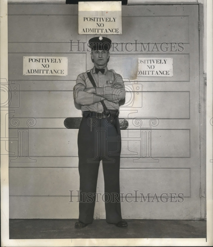 1940 Roy Gibson guards an entrance to section of the Arsenal - Historic Images