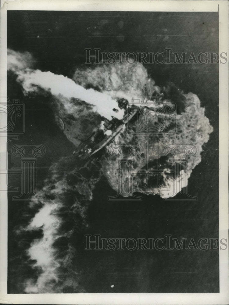 1945 Press Photo Water Around Japanese Freighter&#39;s Bow Snaps as Flames Rise Into-Historic Images