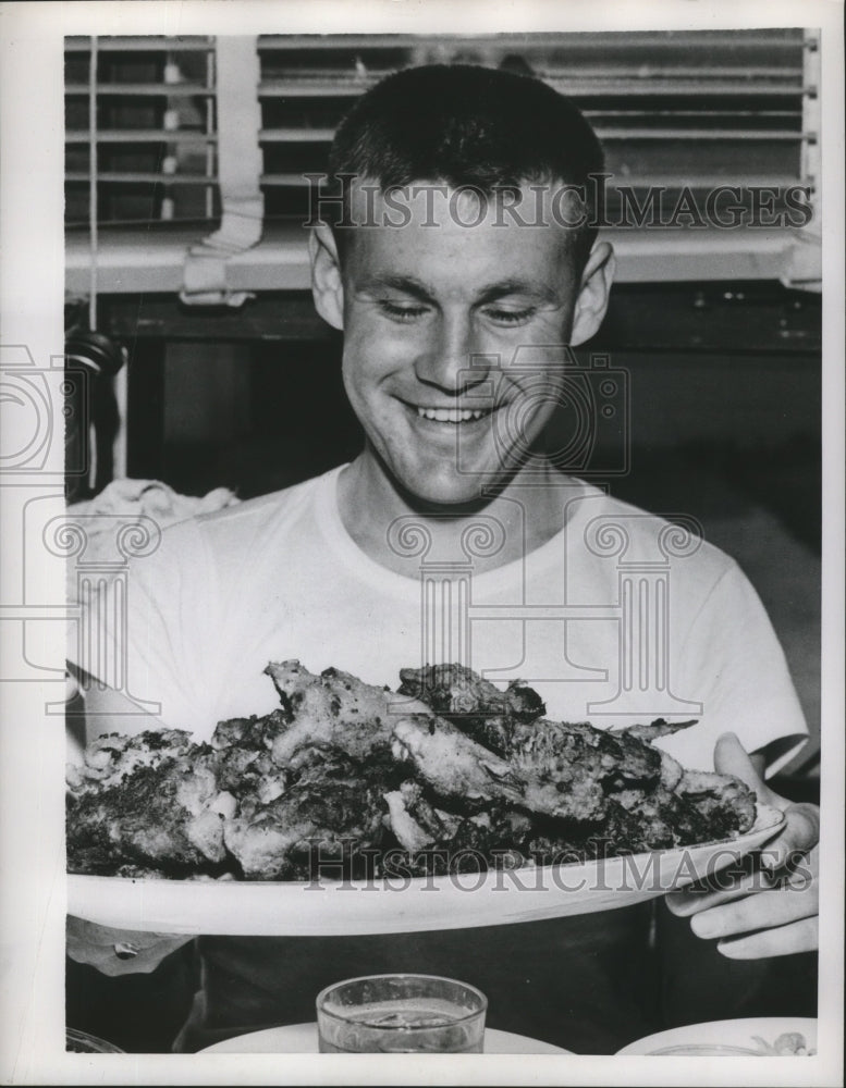 1953 US War veteran who was POW looking at food  - Historic Images