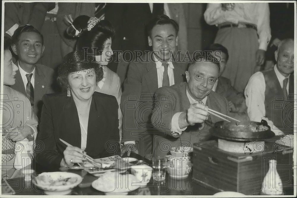 1950 Taylor Spink & Wife at Sukiyahi Party in Tokyo  - Historic Images