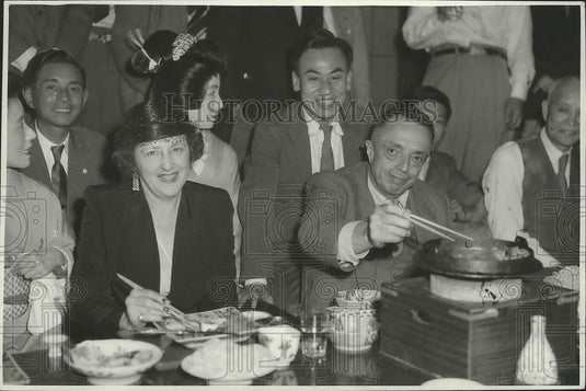1950 Taylor Spink & Wife at Sukiyahi Party in Tokyo  - Historic Images