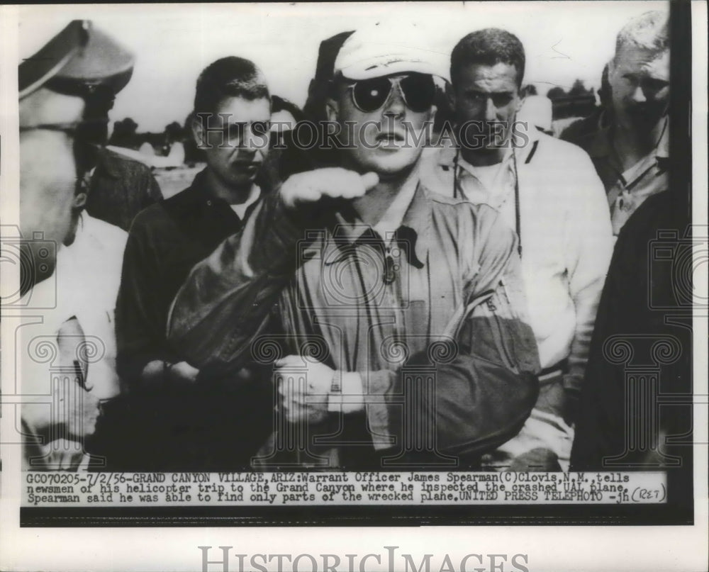 1956 Officer James Spearman Tells Newsmen of Helicopter Trip - Historic Images