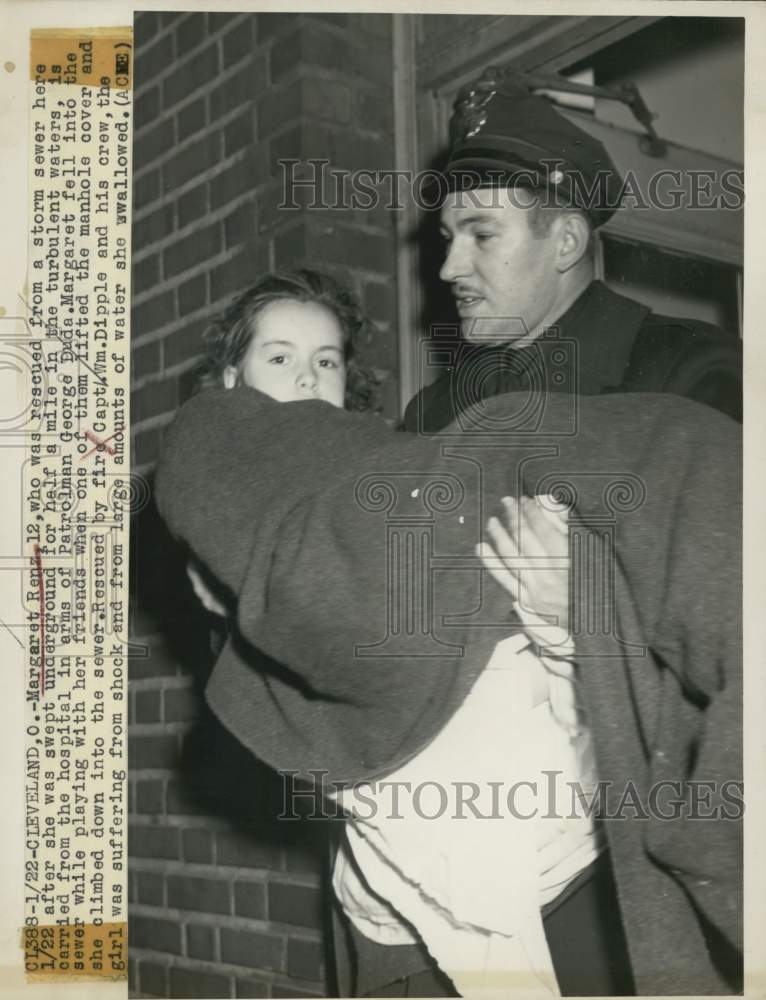 1949 Ohio-Patrolman George Duda carries Margaret Renz to hospital - Historic Images