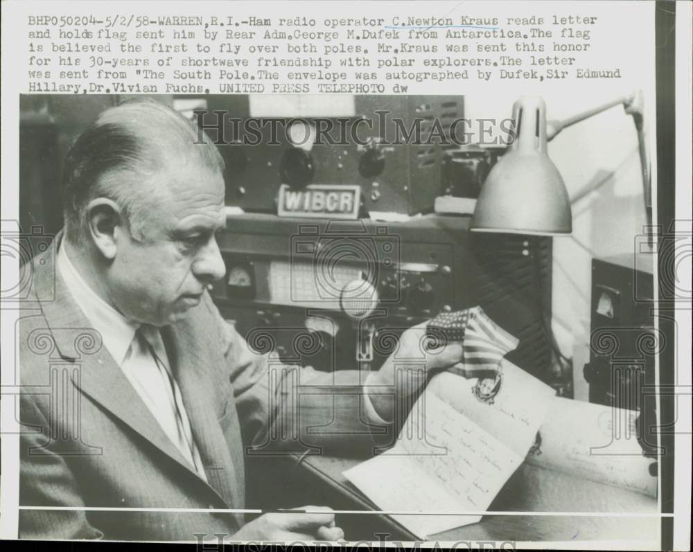 1958 Press Photo C. Newton Kraus reads letter &amp; holds flag sent from Antarctica- Historic Images