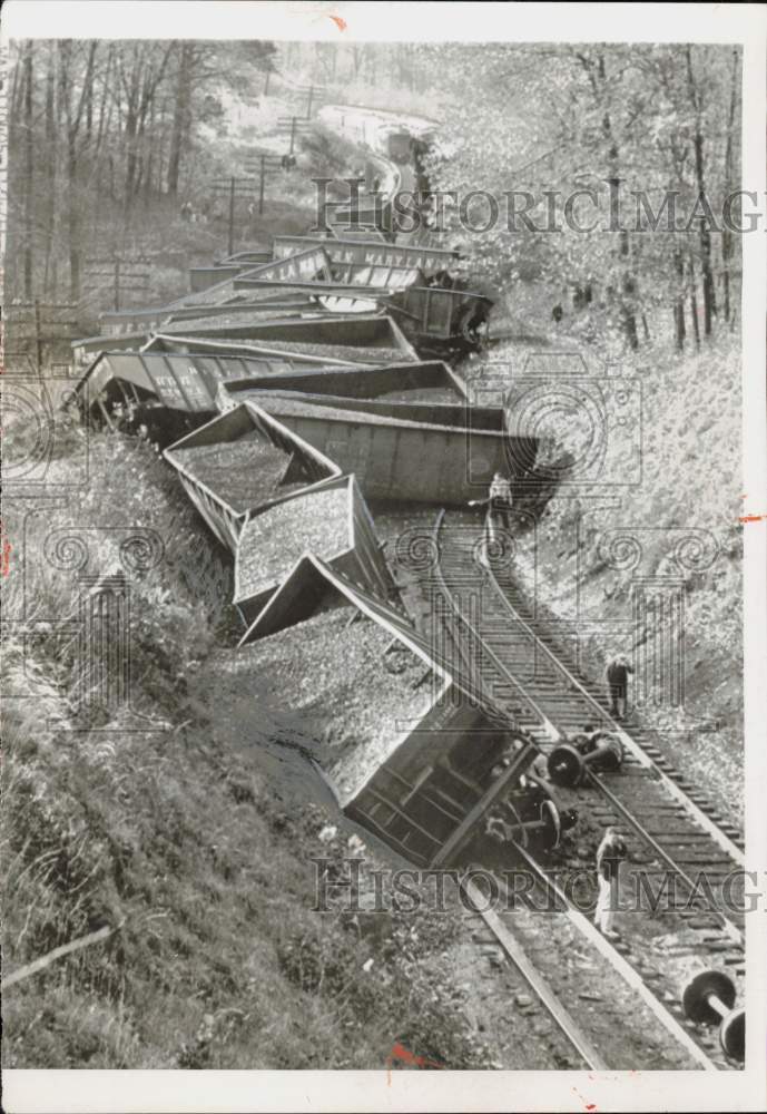 1955 Press Photo Men inspect wreckage of derailed freight train cars - nei23413- Historic Images