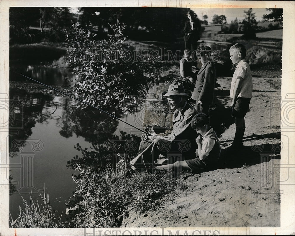 1942 Press Photo Irish Youngster look U.S. Army Fishing at Northern Ireland Camp-Historic Images