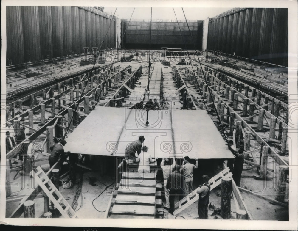 1949 Kneel of the USS United States is maneuvered into position. - Historic Images