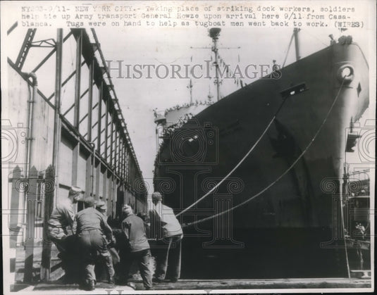 1946 Soldiers help tie up Army transport General Howze upon arrival - Historic Images