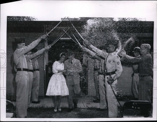 1960 Press Photo Couple walks under sword arch following their wedding-Historic Images