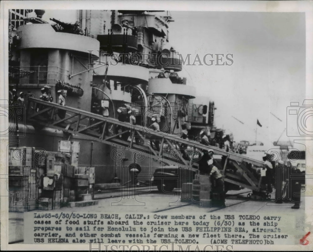 1950 Press Photo Crew of USS Toledo carry crates of food aboard while docked - Historic Images