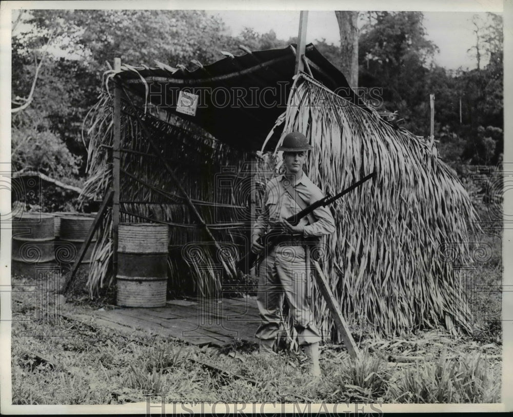 1942 Private John Roark guards his post in Panama Jungle - Historic Images