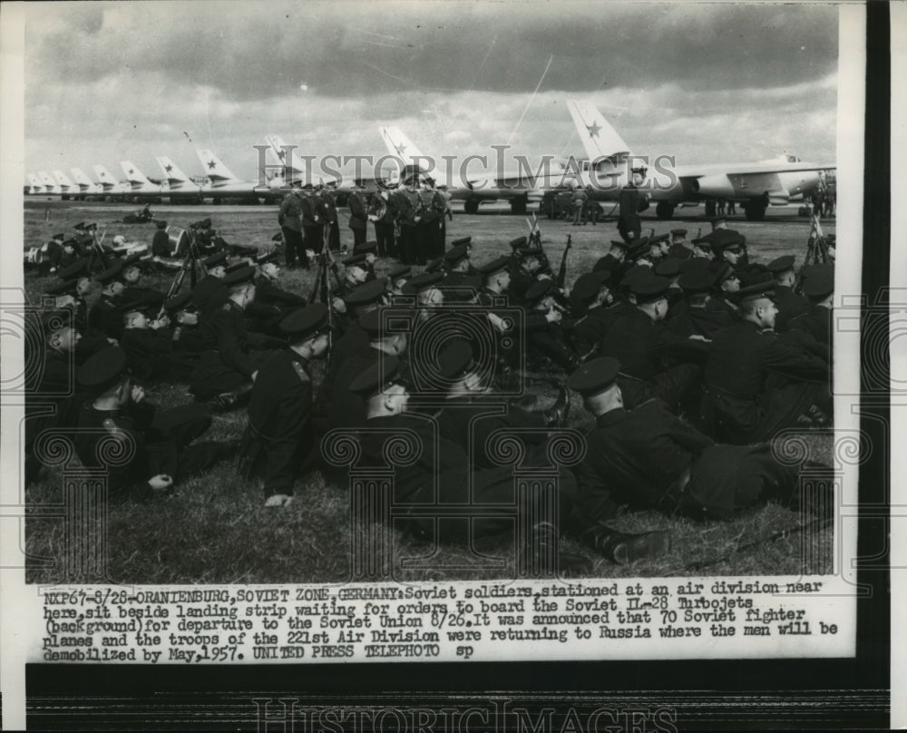 1956 Press Photo Russian Soldiers wait for orders to board Soviet Turbo Jets - Historic Images