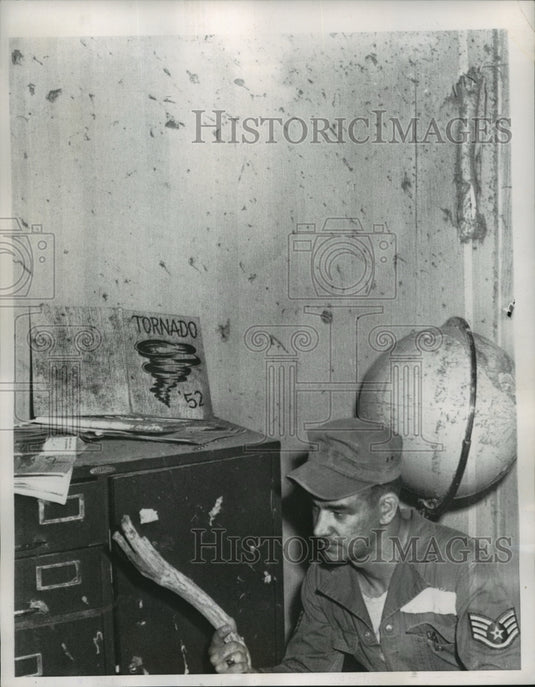 1955 Press Photo Soldier inspects damages at Undall High School after a tornado-Historic Images
