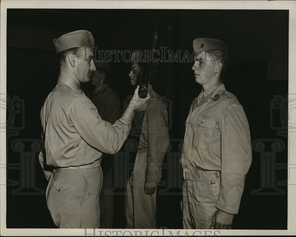 1950 Capt. Steve Golish handing the rifle to Henry Saholle - Historic Images